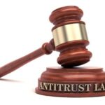 Antitrust laws: The image shows a gavel with the words "antitrust law" written on the sound block