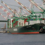 Cost of shipping: Image of an Evergreen ship docked at the port of Los Angeles