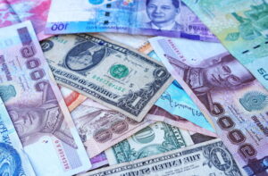 Money and finance: A picture of banknotes of various countries and denominations.