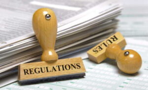 Image of papers with two stamps "bank regulations" and "rules"